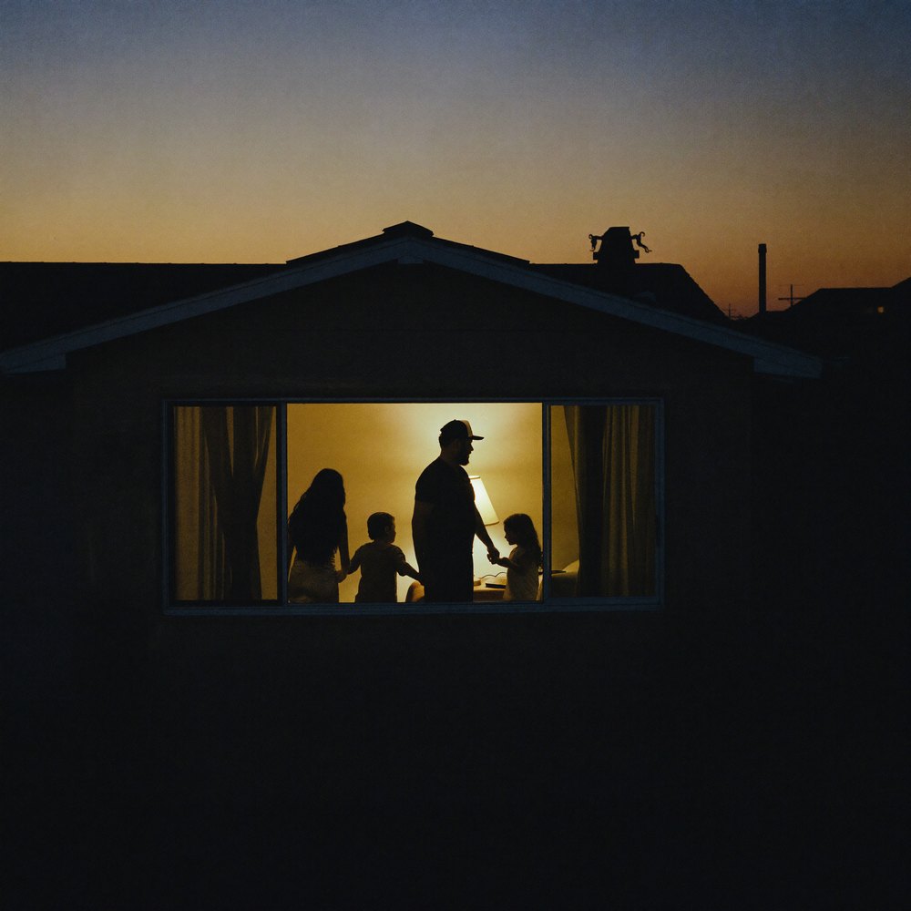even if.. album cover: a family silhouetted in a lit window at dusk